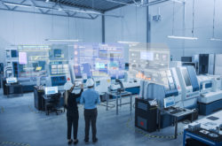 Industry 4.0 Factory: Two Engineers Uses Digital Tablet Computer with Augmented Reality Software to Connect with High-Tech Machinery, Robot Arm and Visualize Maintenance and Diagnostics of Equipment