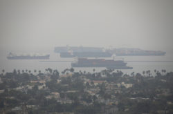 Cargo vessels dock off the California coast.