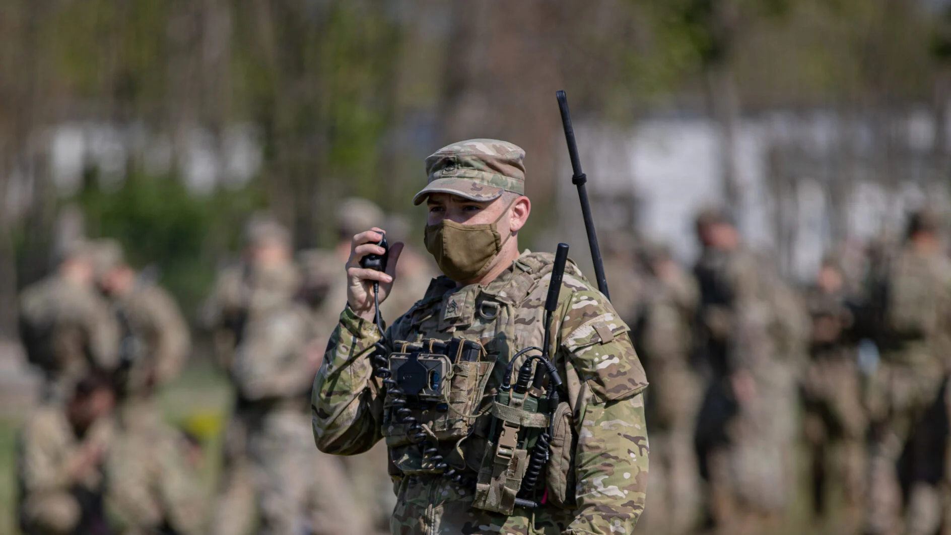 A U.S. Army paratrooper assigned to the 173rd Airborne Brigade tests his PRC-163 radio to ensure that communications are ready before conducting an airborne assault into Bulgaria during exercise Swift Response 21 in Papa Air Base, Hungary, May 8, 2021